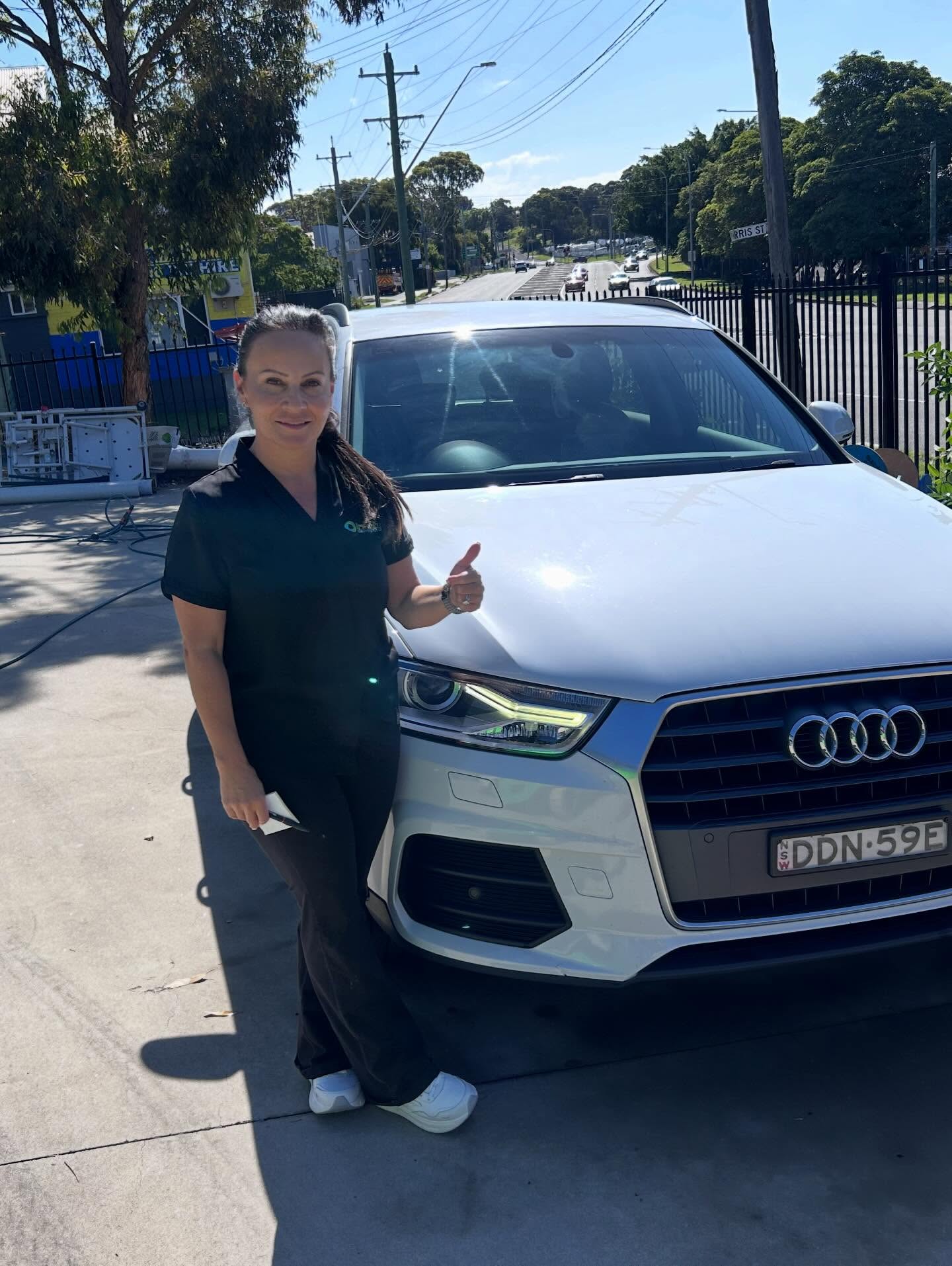 Happy customer with freshly detailed Kia Carnival