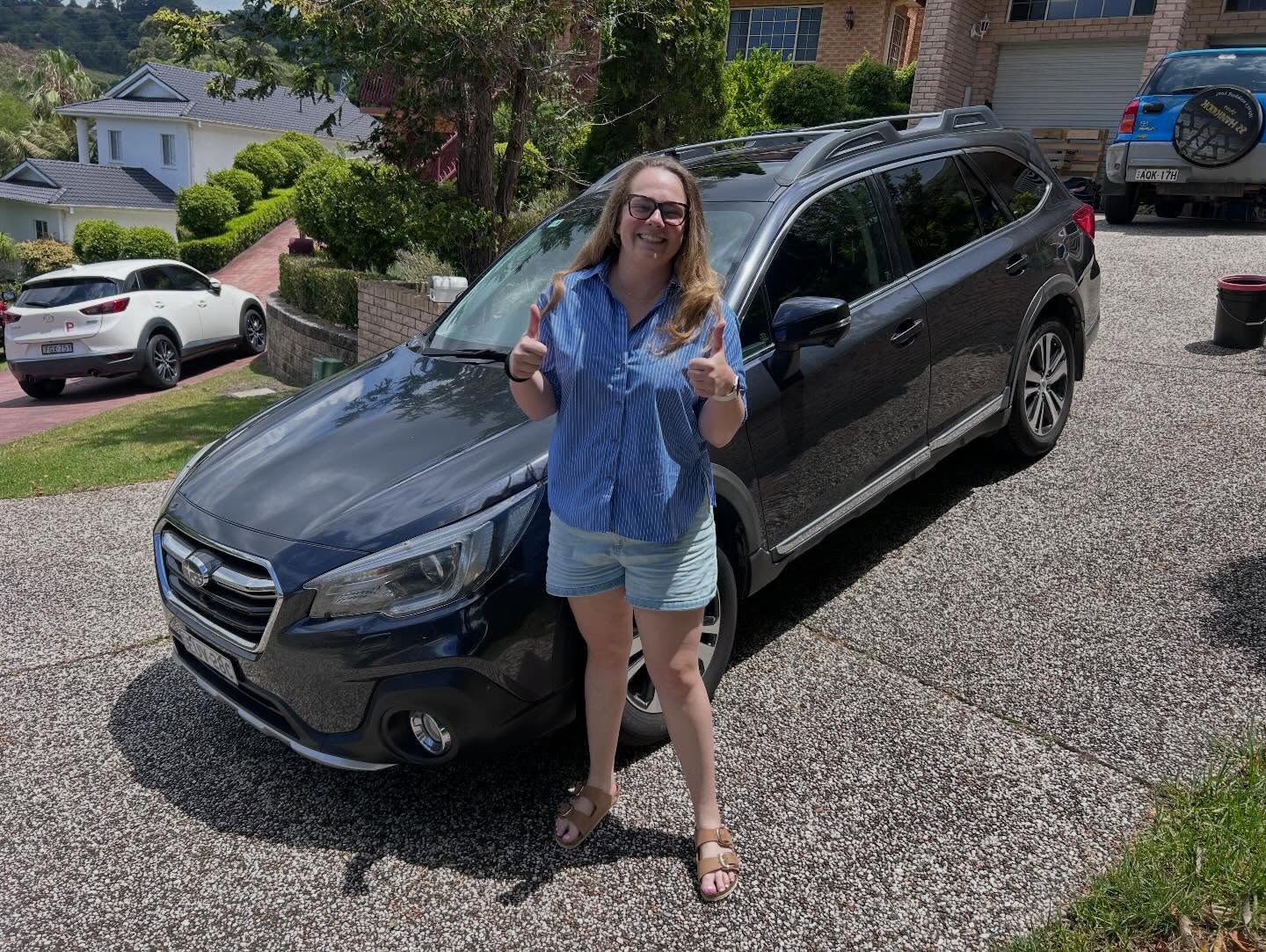 Happy customer with freshly detailed Toyota Prado